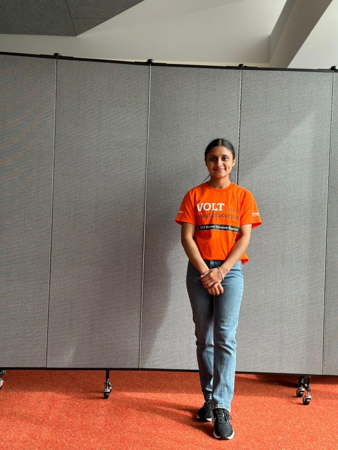 Arshnoor Kaur volunteering at an event in Langara College's T Gallery.