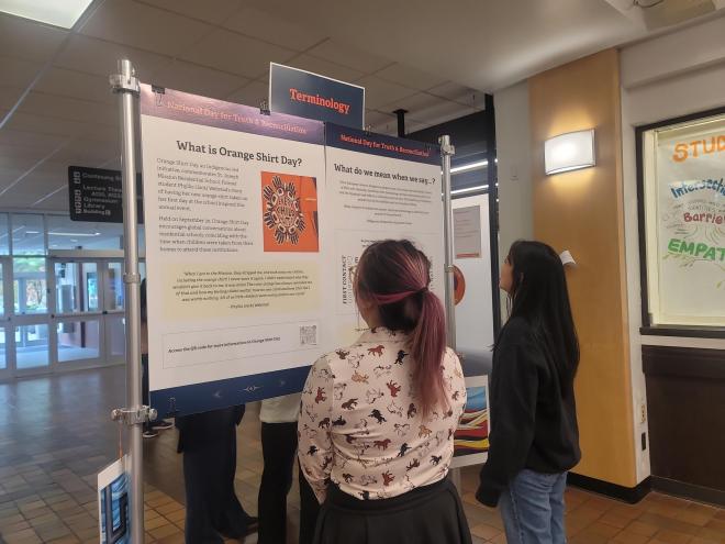 Early Chilldhood Education students read about Orange Shirt Day at National Day for Truth and Reconciliation Education Stations at Langara College.