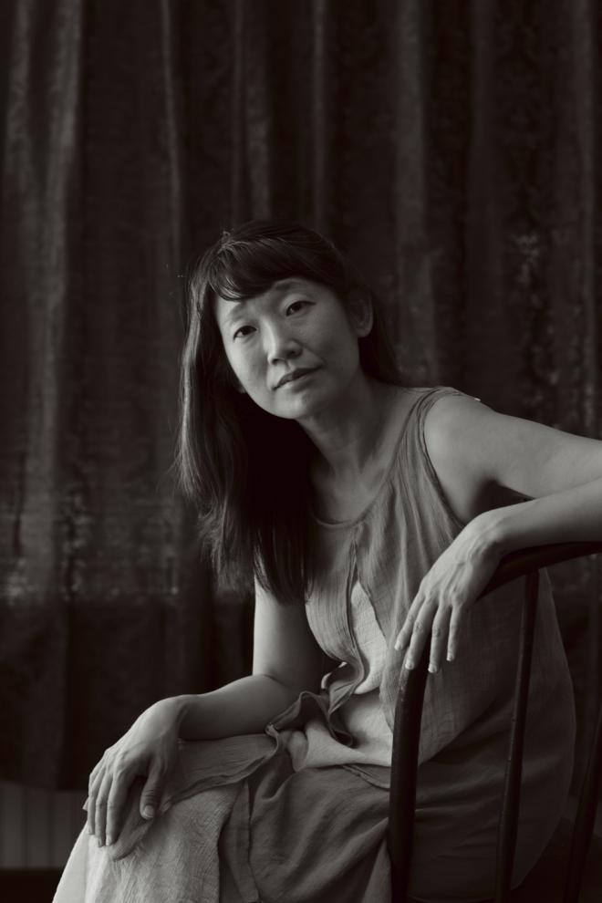 Black and white image of Madeleine Thien seated. Photo by Andrew Querner.