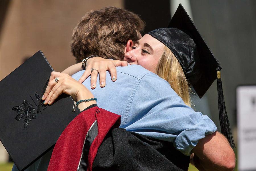 Graduate hugging a family-member.jpg