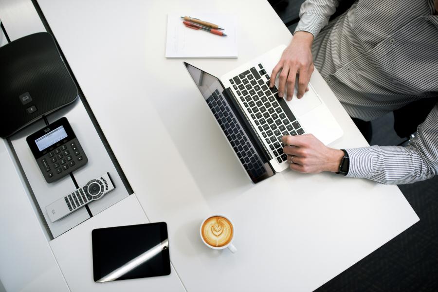 stock image of man on laptop
