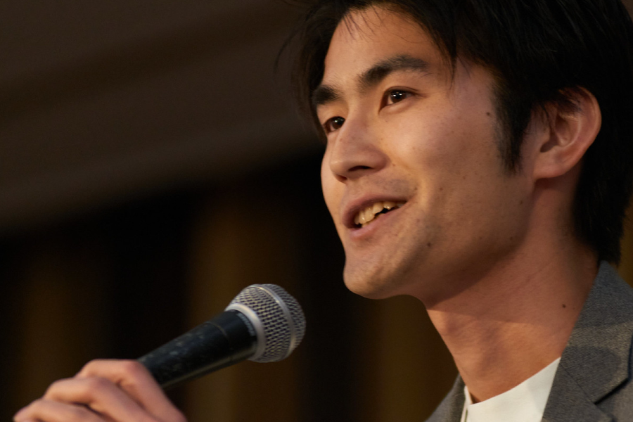 alumnus speaking at event