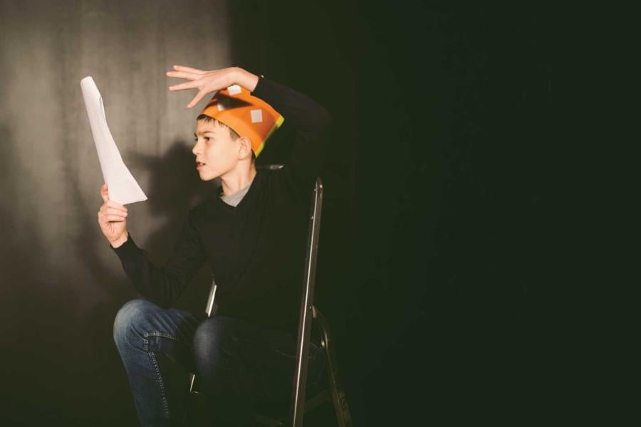 Student exploring his ideas with acting