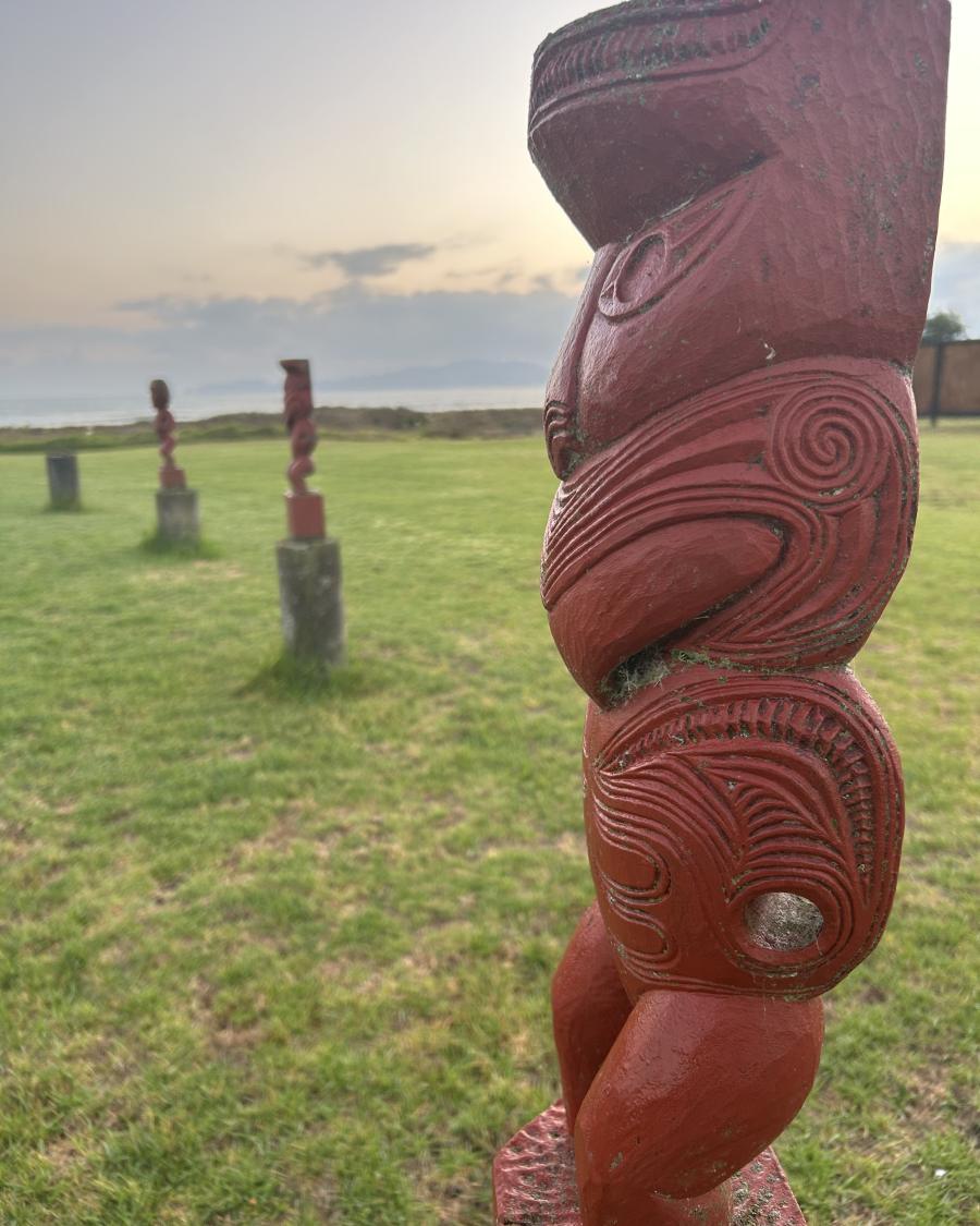 A carved Māori statue.