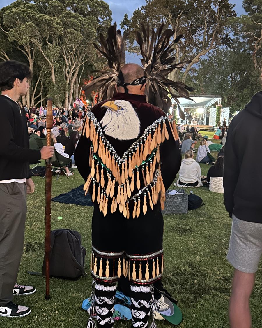A Māori community member in traditional dress.